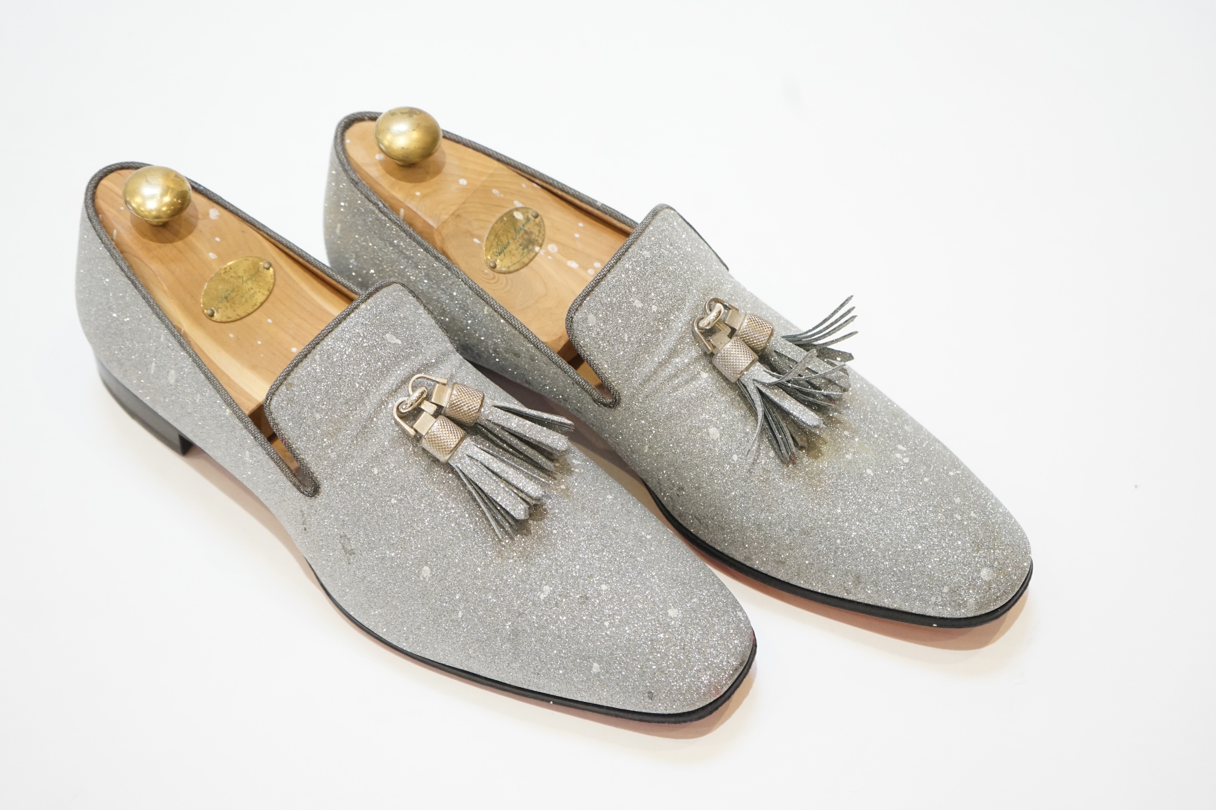 A pair of gentleman's Christian Louboutin silver glitter tasselled loafers, in shoe bag, size 42.5